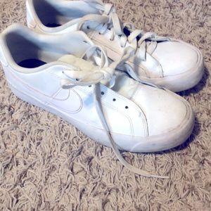 A pair Nike white shoes